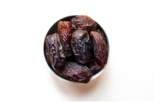 Dates in a white bowl