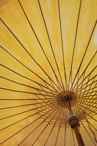 istock close up of under a yellow umbrella 1432454236