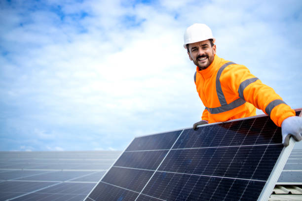 istock Installing solar panels on rooftop for sustainable energy. 1432455930
