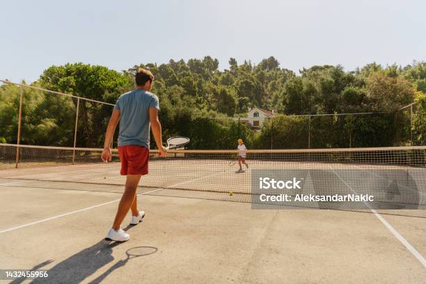 Practicing Tennis With My Dad Stock Photo - Download Image Now - 35-39 Years, 8-9 Years, Active Lifestyle