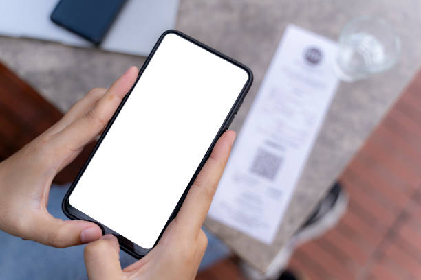 istock A woman using a smartphone for financial transactions. Hold a phone with a blank screen in your hand. Mobile phone payment 1432458734