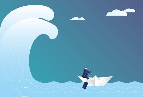 Business man sailing in huge waves with paper boat, escaping from adversity