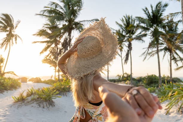 istock POV couple walking towards tropical beach at sunset 1432462999