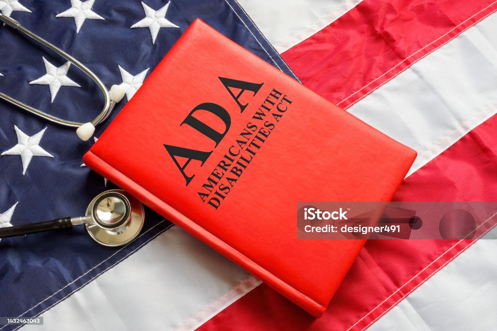 American flag, book The Americans with Disabilities Act ADA law and stethoscope. American flag, a book The Americans with Disabilities Act ADA law and stethoscope. Americans with Disabilities Act Stock Photo