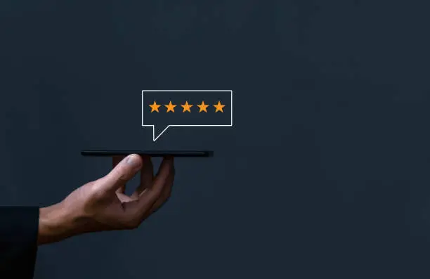 Photo of positive customer reviews write a five-star review. Satisfaction, Feedback, and Customer Service Concepts Best response from the product user experience. dark background