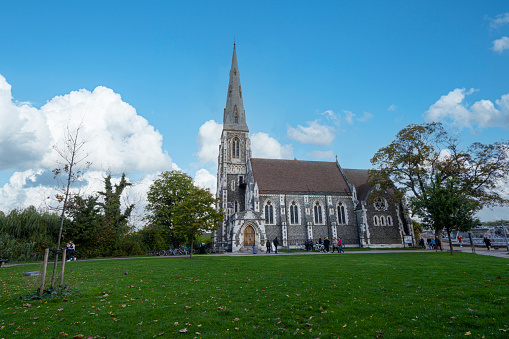 Copenhagen, Denmark. October 2022. exterior view of St Alban's Church, a traditional Anglican church consecrated in 1887 with a spire and stained glass windows in the city center