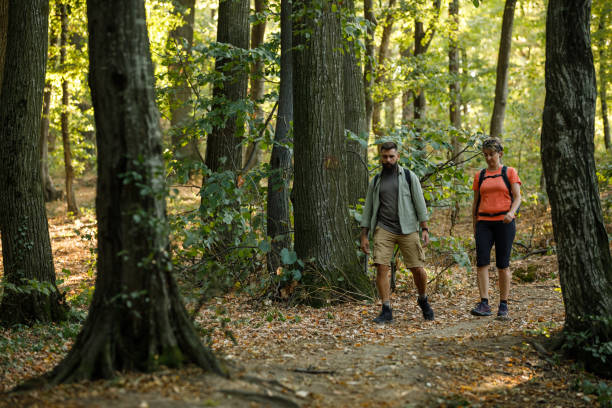 istock Mother and son casually chatting while hiking through the forest 1432464866
