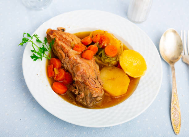 istock Appetizing pork ribs with potatoes and vegetables 1432465049