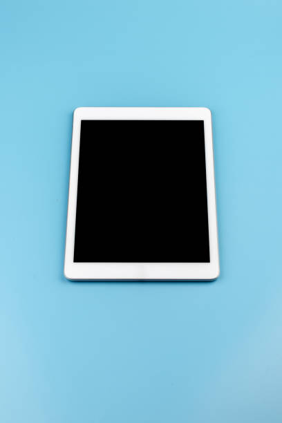 istock Top view of tablet on the blue pastel color background. 1432465916