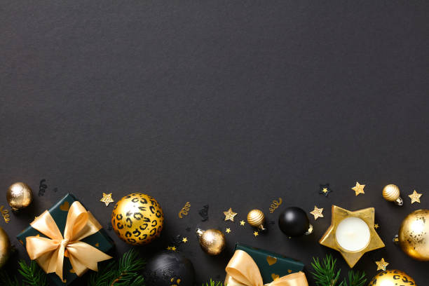 istock Gold and Black luxury Christmas bauble, gift boxes, fir branches on black background. 1432468209