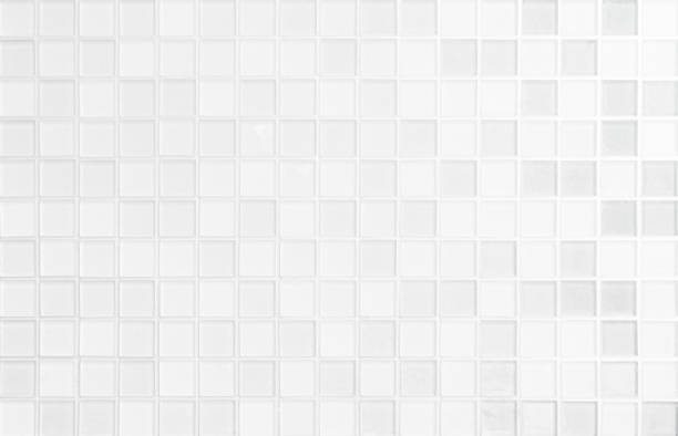 istock White tile wall chequered background bathroom floor texture. Ceramic wall and floor tiles mosaic background in bathroom and kitchen clean. Design pattern geometric with grid wallpaper decoration pool. 1432469426