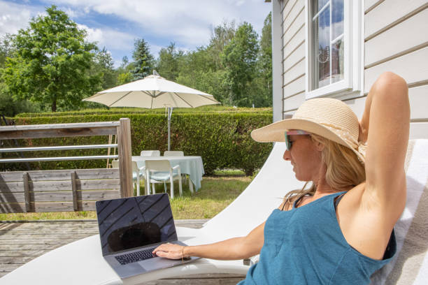 istock Woman using a laptop at home, working and studying 1432470470