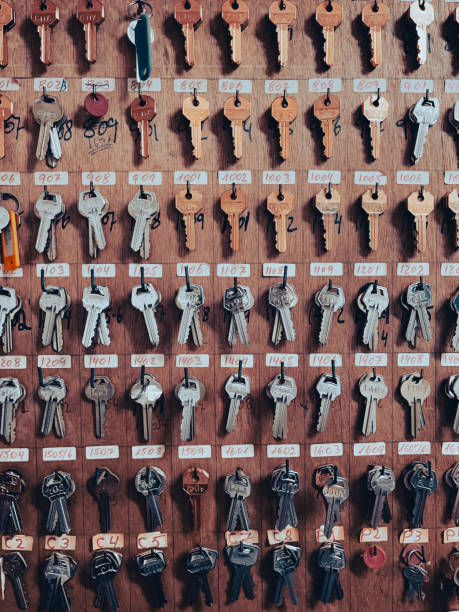 istock Key box cabinet or locker key for storage with many keychains and track colors hanging inside. 1432470657