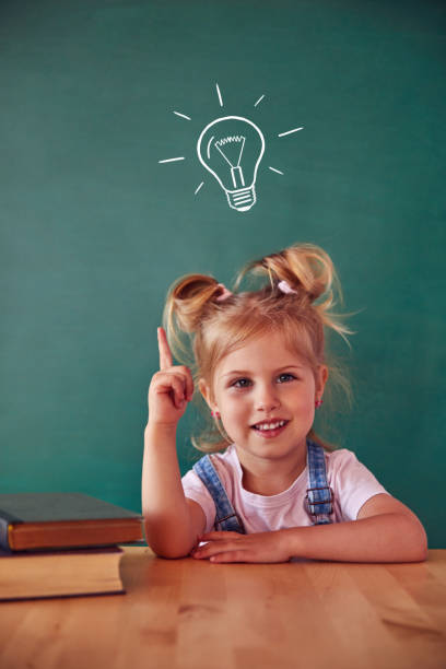 istock Funny kid against green chalkboard 1432471444