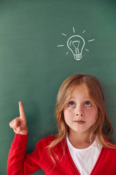 istock Funny kid against green chalkboard 1432471586