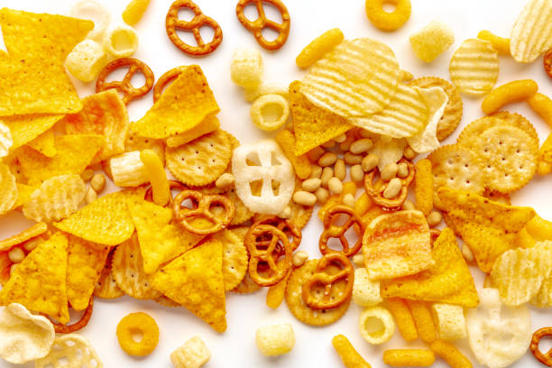 istock Salty snacks texture on a white background. Party food assorted mix 1432472365