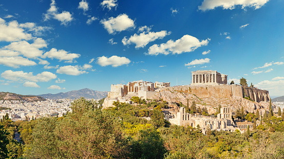 Zeus temple overlooking Acropolis, Athens, Greece. These are famous landmarks of Athens. Sunny view of Ancient Greek ruins, great columns of classical building in Athens city center. Travel concept.