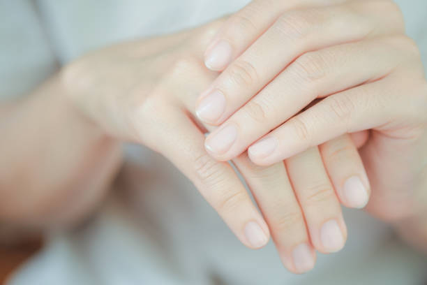 istock Close-up of woman's fingernail. Hand concept. 1432475007