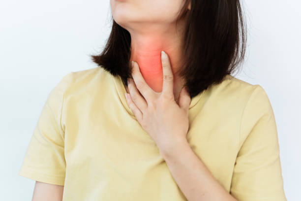 istock A woman has an itchy or sore throat. Indicates that there is a health problem. 1432475137