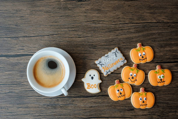 coffee cup and  funny Halloween Cookies. Happy Halloween day, Trick or Threat, Hello October, fall autumn, Traditional, party and holiday concept coffee cup and  funny Halloween Cookies. Happy Halloween day, Trick or Threat, Hello October, fall autumn, Traditional, party and holiday concept gross coffee stock pictures, royalty-free photos & images