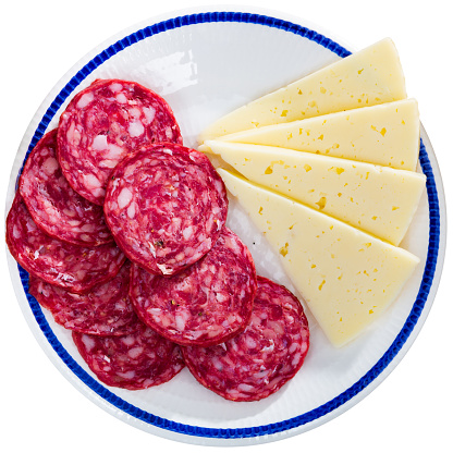 Sliced meat sausage and cheese served on plate as appetizer. Isolated over white background
