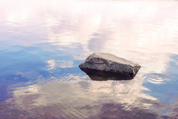 Stone. Sky. Reflection