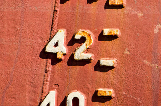 Number 42 on a ship's hull Close-up of the draught marks on a weathered ship's hull, focussing on the number 42 number 42 stock pictures, royalty-free photos & images