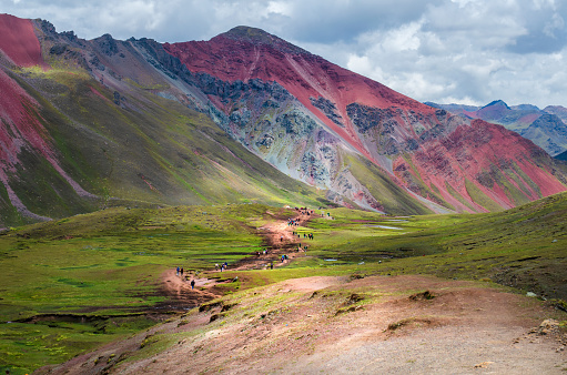 Hiking route to Rainbow mountain in Peru also know as Vinicunca, or Winikunka, or Montaña de Siete Colores, Montaña de Colores or Rainbow Mountain, is a mountain in the Andes of Peru with an altitude of 5,200 meters above sea level.