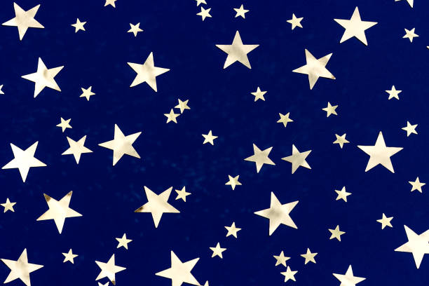 istock Golden stars glitter on blue background. Festive holiday backdrop 1432483200