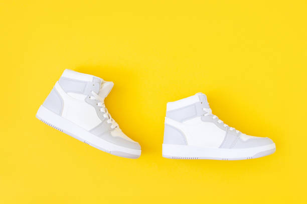 istock Shoes on yellow background. Step by step in flat style. Success and development creative concept. Top view 1432483214