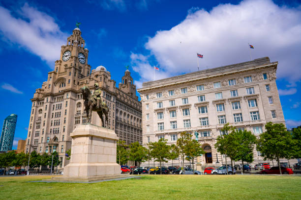 Liverpool Pier head Edward Vll Statue with Royal Liver building and Cunard buildingin England UK United Kingdom
