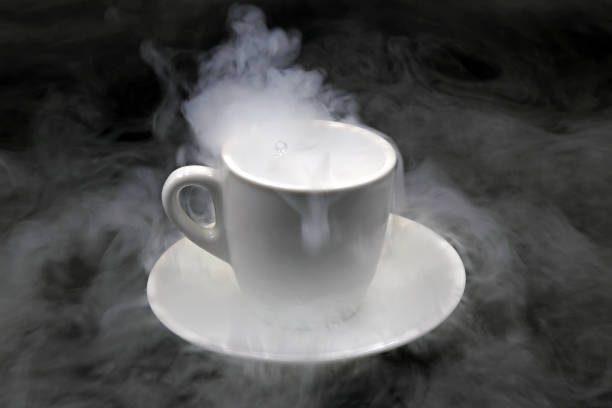 istock Cup of coffee on a dark background, smoky 1432484310