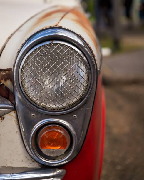 istock Vertical closeup of headlights on a vintage car 1432484823