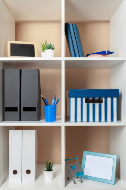 istock File folders, standing on the shelves at office 1432486893