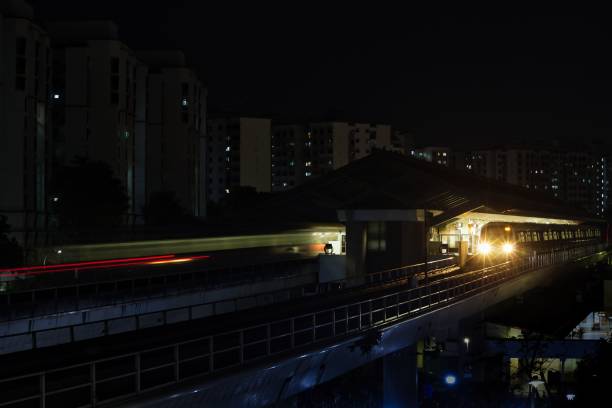 istock Shot of a train track with a train on it during nighttime 1432487535
