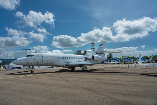 , Singapore: A Huge and newly developed large Dassault Falcon 8X Business Jet on the land under blue sky