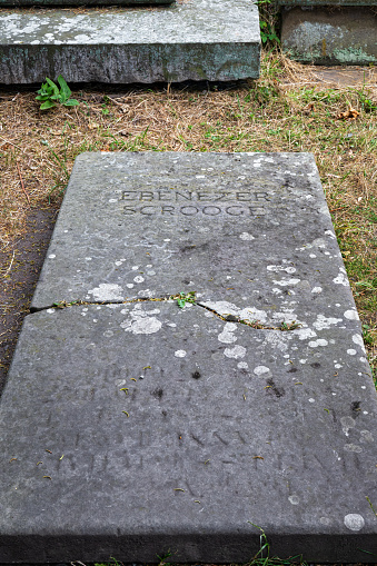 Shrewsbury, UK-  July 14, 2022: The Grave stone of Ebenezer Scrooge used in the 1984 Christmas Carol movie, filmed in Shrewsbury, Engalnd.