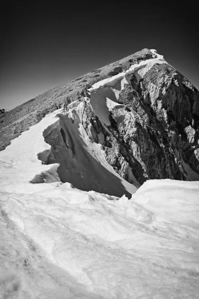 istock Greyscale shot of a mountainous landscape covered with snow 1432490881