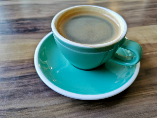 istock Hot plain black Americano coffee served in glass mug on wooden table 1432490899