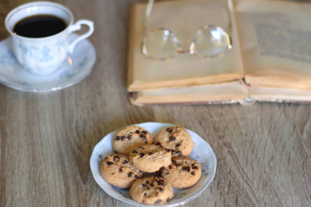 istock Tea, Cookies, Book, Candles and Lavender 1432490990