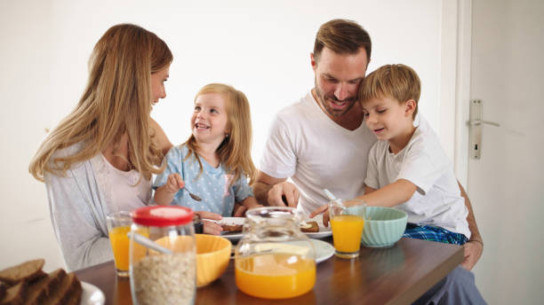 istock Parents with their kids in dining room having breakfast together 1432492575