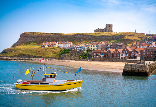 Whitby skyline and river Esk and boats UK in Scarborough Borough Concil of England United Kingdom