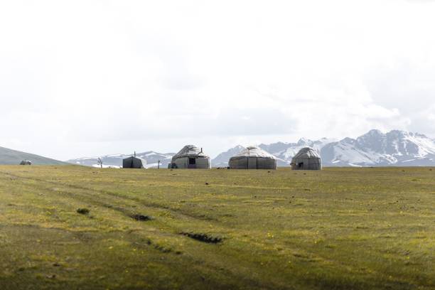 istock White tent in mountain valley with a cloudy sky 1432496765