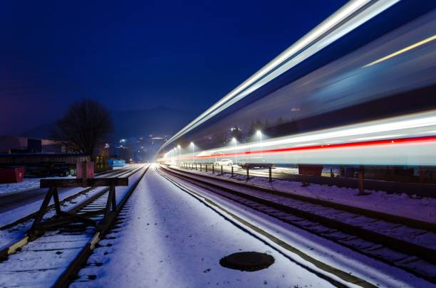 istock Train station and train lights in long exposrue effect at night 1432497684
