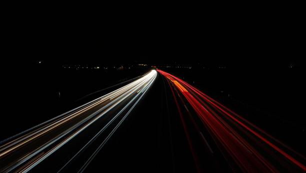 istock Long exposure of a road with light trails 1432499157
