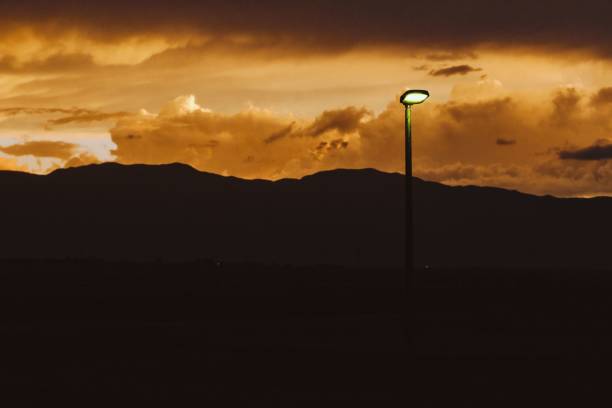 istock Beautiful sunset with orange sky and hills silhouettes. 1432502679