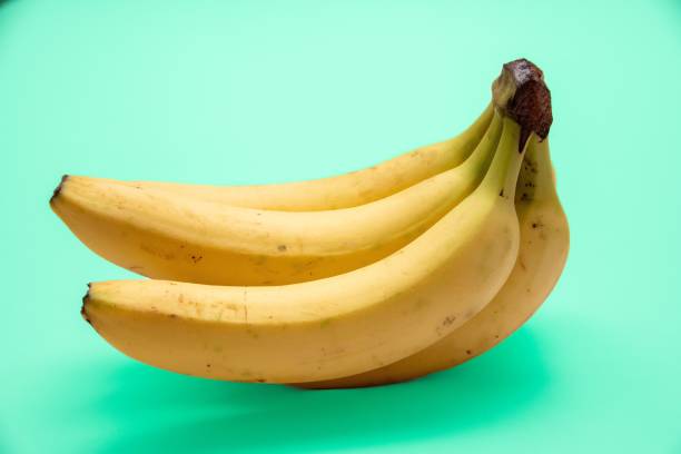 istock Fresh ripe banana isolated on a blue background 1432502995
