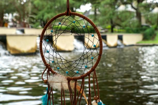 istock Dreamcatcher willow hoop with a beautiful waterfall in the background 1432502999