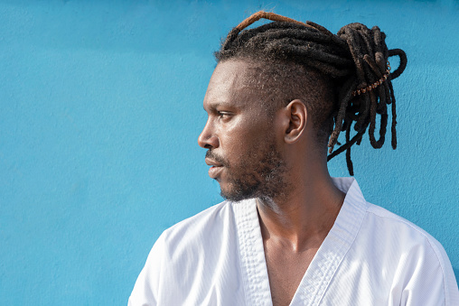 portrait of a handsome African American man on a blue background