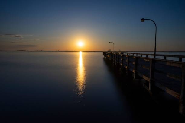 istock Aerial view of bridge in sea during sunset 1432506708